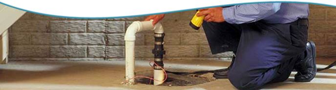 Man inspecting sump pump